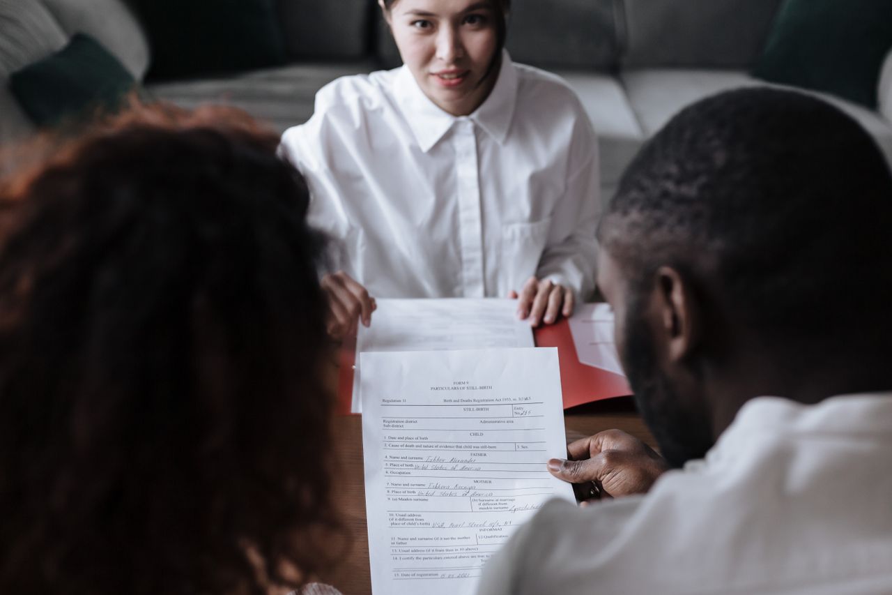 Legal team reviewing documentary evidence in a confidential trust dispute.